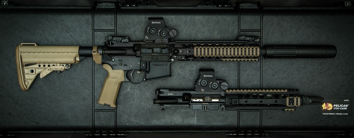 Two AR-15 rifles in a black case