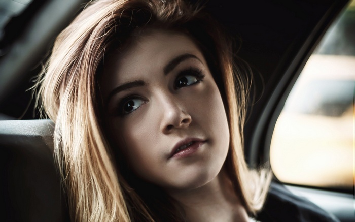 Chrissy Costanza inside a car