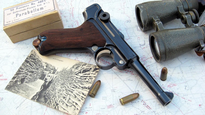 Luger P08 pistol with ammunition and binoculars