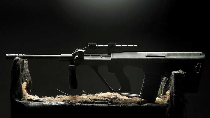 Steyr AUG assault rifle on a dark background