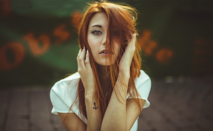 Victoria Ryzhevolosaya with red hair and anchor tattoo