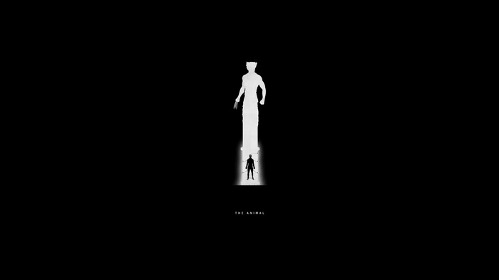 Wolverine silhouette standing before a giant statue