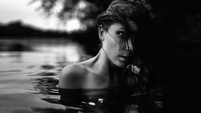 Monochrome portrait of a woman in water