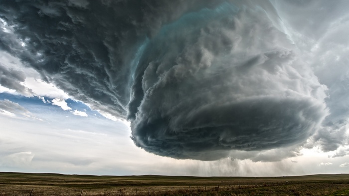 Supercell storm over a field in Wyoming, USA
