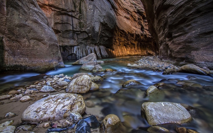 River flowing through a narrow canyon with rock walls