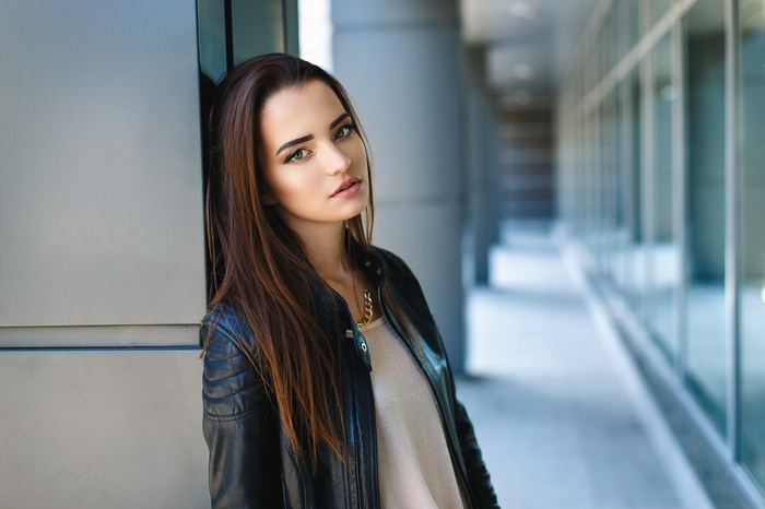 Portrait of a young woman in a leather jacket