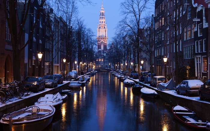 Amsterdam canal in winter with Westerkerk tower