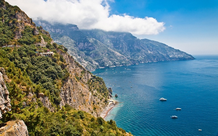 Amalfi Coast with yachts and mountains in Italy