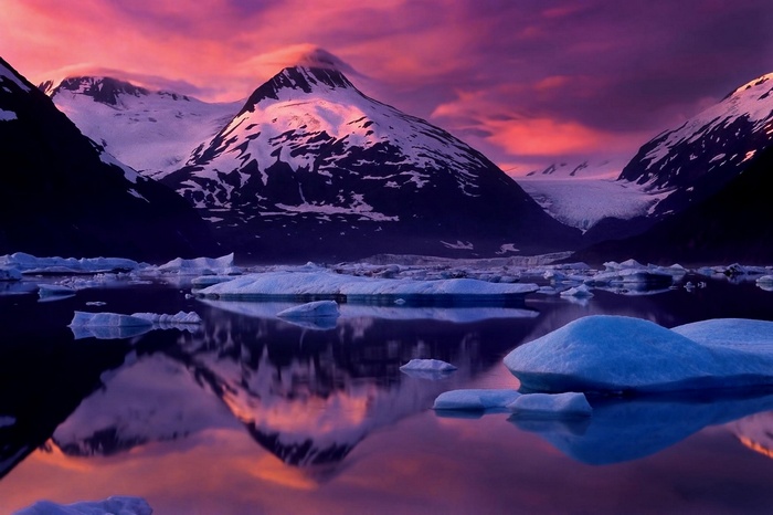 Sunset over snowy mountains and glaciers in Alaska