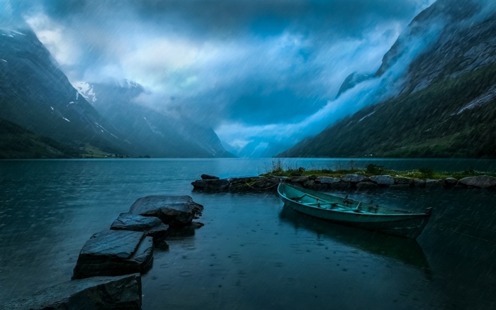 Boat on a lake in Norway during rain