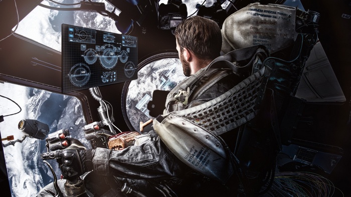 Astronaut in a space station cockpit overlooking Earth