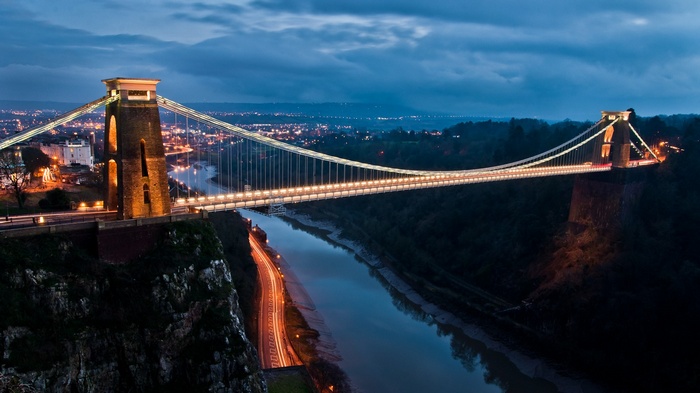 Clifton Suspension Bridge at dusk with city lights