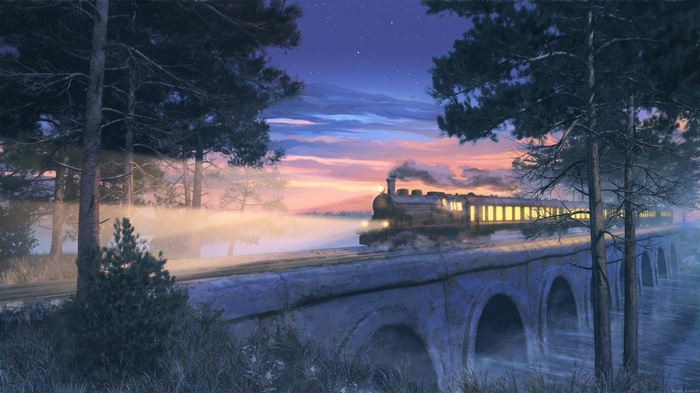 Steam train crossing a bridge at dusk