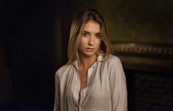 Portrait of a blonde woman in a striped shirt