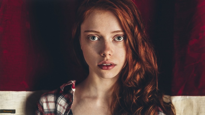Redhead woman with striking green eyes
