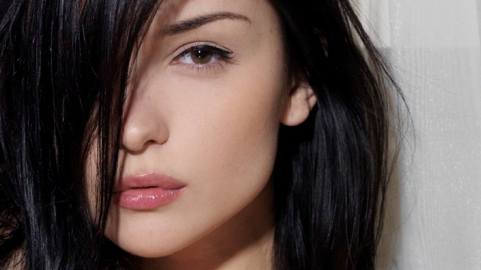 Katie Fey with black hair and brown eyes