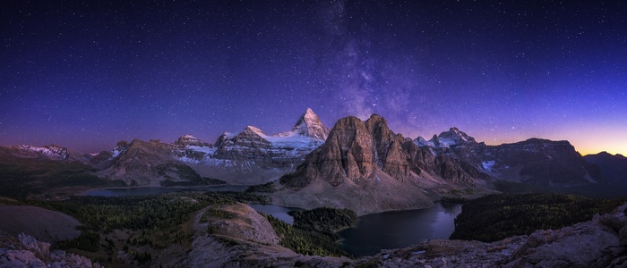Milky Way over Canadian Rocky Mountains and lakes