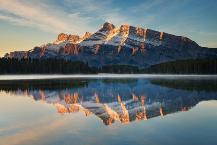 Mountaintop reflection on a calm lake in Canada