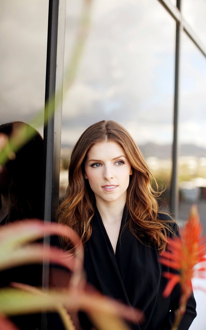 Anna Kendrick in a black coat