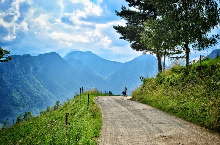 A person on a bicycle on a mountain road