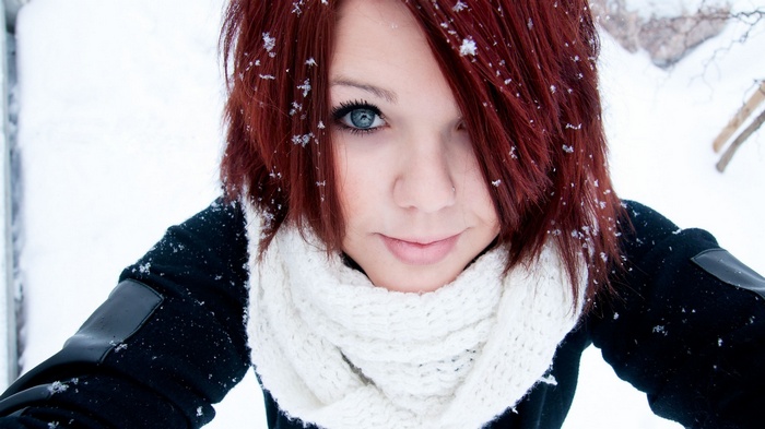 Woman with red hair in the snow