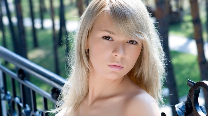 Young woman with blonde hair outdoors