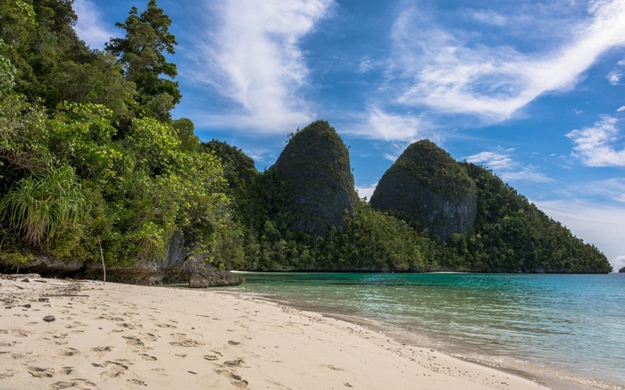 Tropical beach with karst islands in Raja Ampat, Indonesia