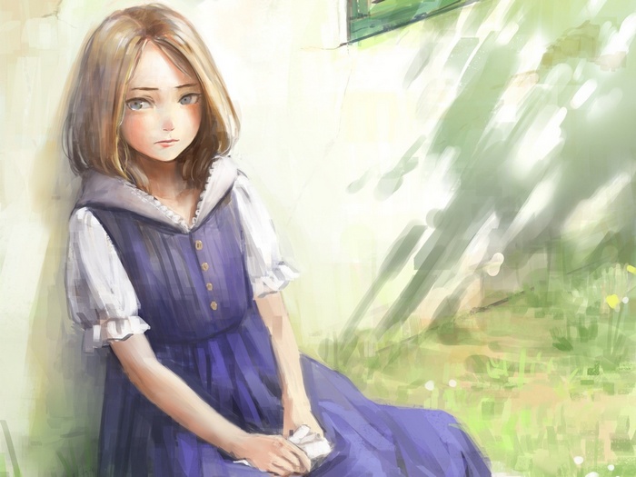 Girl in blue dress sitting by a wall