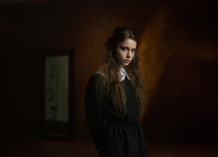 Portrait of Ksenia Kokoreva in a black dress