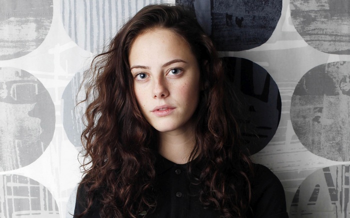 Kaya Scodelario portrait with patterned background
