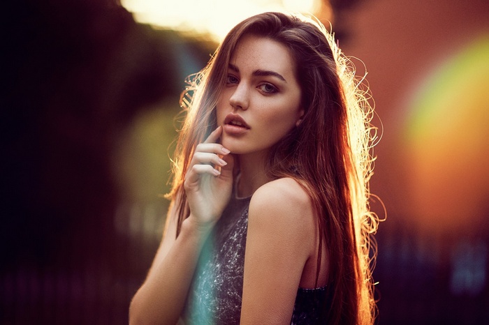 Portrait of a young woman with long brown hair