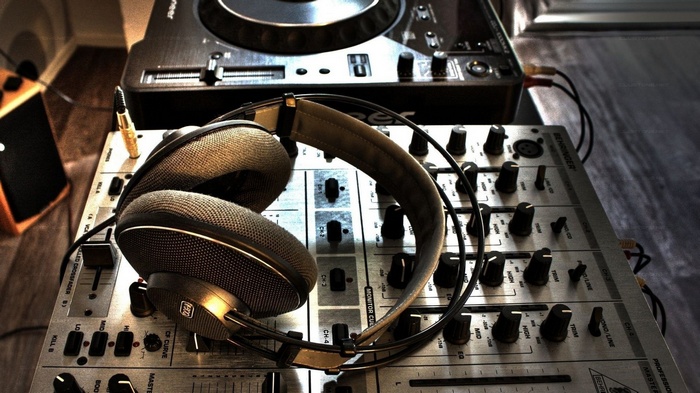 Pioneer DJ turntable and Behringer mixer with headphones