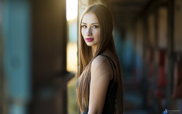 Portrait of a young woman with long brown hair