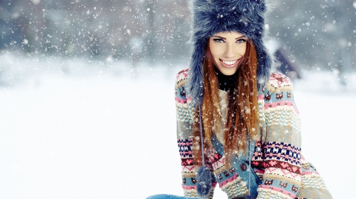 Redhead woman in a snowy landscape