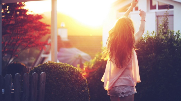 Girl with long hair in sunlight
