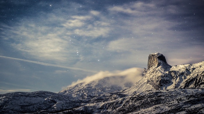 Snowy Mountains Under a Starry Night Sky