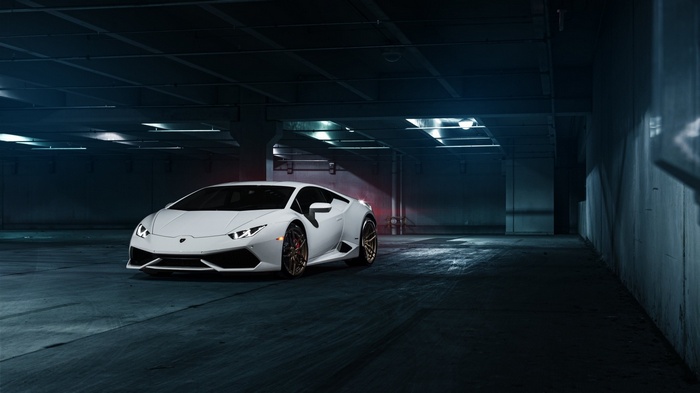 White Lamborghini Huracan LP610-4 in a dark parking garage