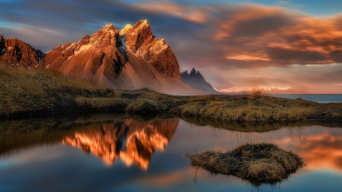 Mountains reflected in a lake at sunset