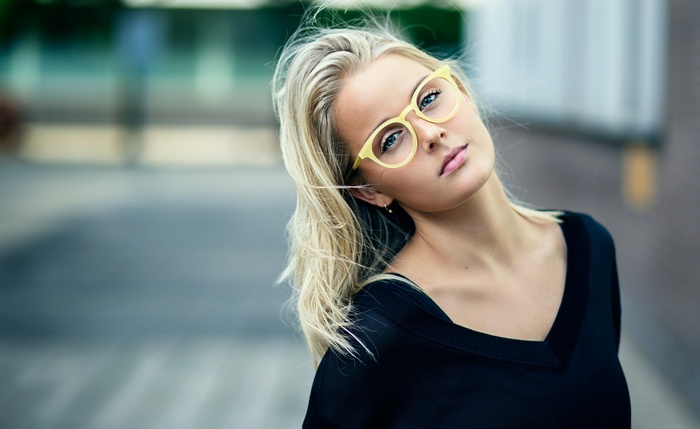 Portrait of a blonde woman with glasses
