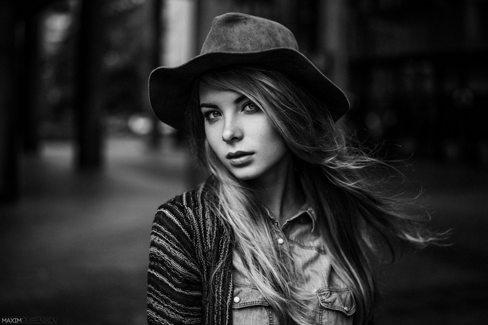 Woman wearing a hat by Maxim Guselnikov
