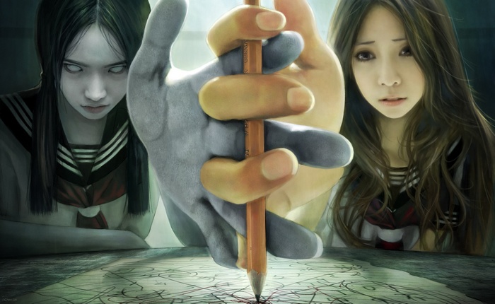 Two girls and a hand holding a pencil
