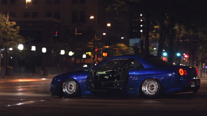 Blue Nissan Skyline GT-R R34 tuned car at night