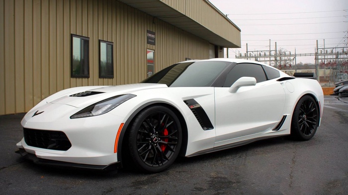 White 2015 Chevrolet Corvette Z06 parked outside building