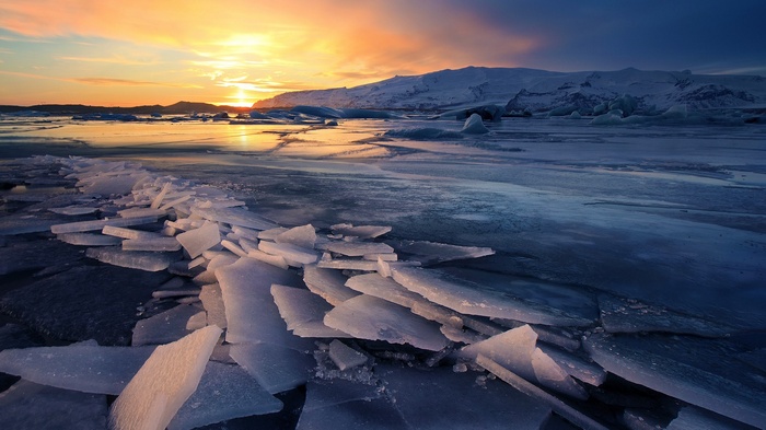 Sunset over a frozen landscape in Iceland with glaciers