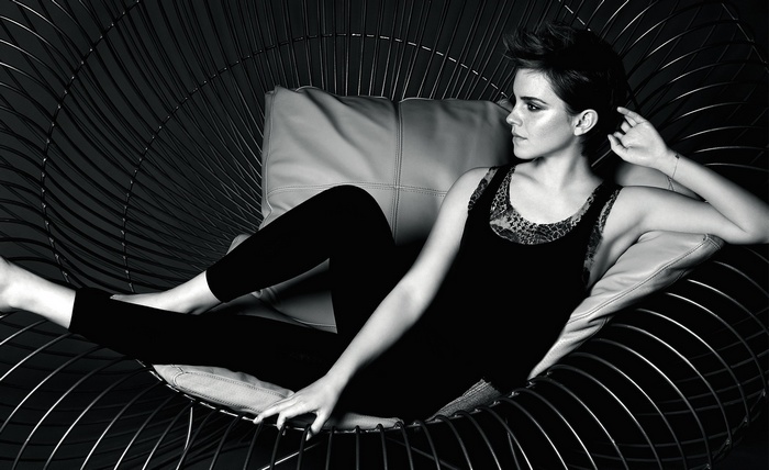 Emma Watson in a black tank top and leggings