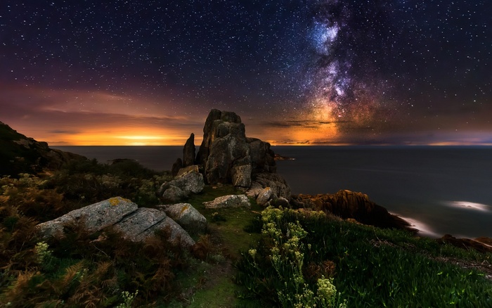 Milky Way over rocky coast in France