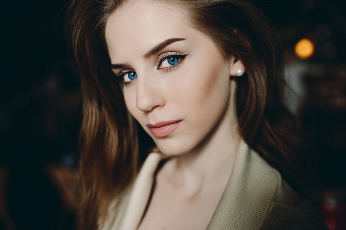 Portrait of a woman with striking blue eyes
