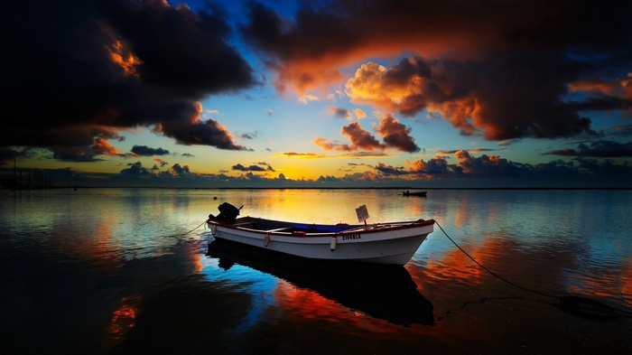 Boat on the water at sunset
