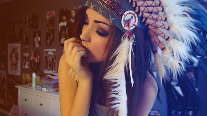 Woman wearing a Native American headdress