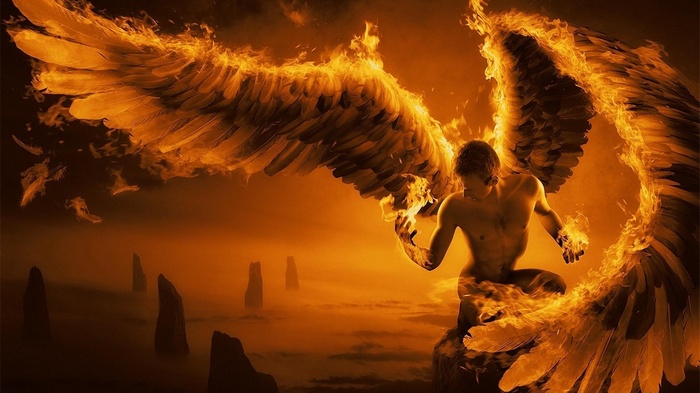 Angel with fiery wings in a misty landscape